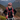 Smiling hiker wearing Bluey Merino short chute in Teal mountains in the background Photography © Rachel Dimond